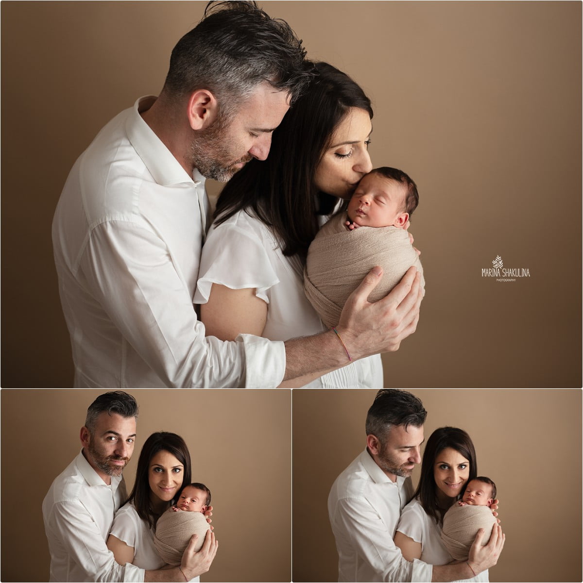 neonata in fascia beige in braccio alla mamma e papà